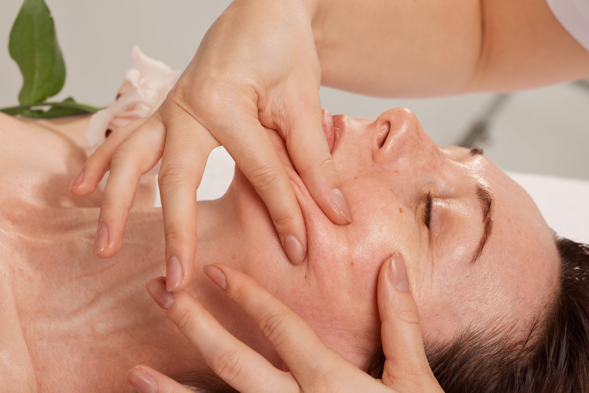 cosmetologist-doing-facial-massage-to-a-girl-in-a-2025-03-18-18-30-18-utc